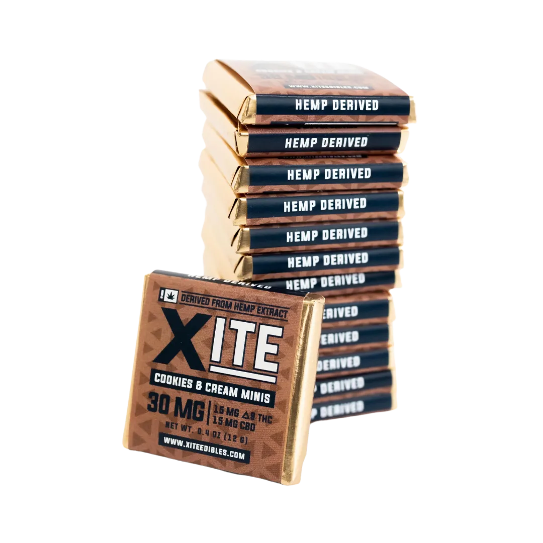 Stack of THC infused Cookies & Cream white chocolate by XITE with transparent background